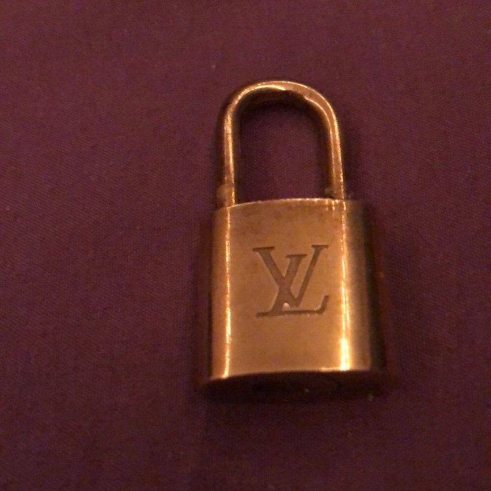 Louis Vuitton Gold Padlock Number 319  comes with Key Authenic